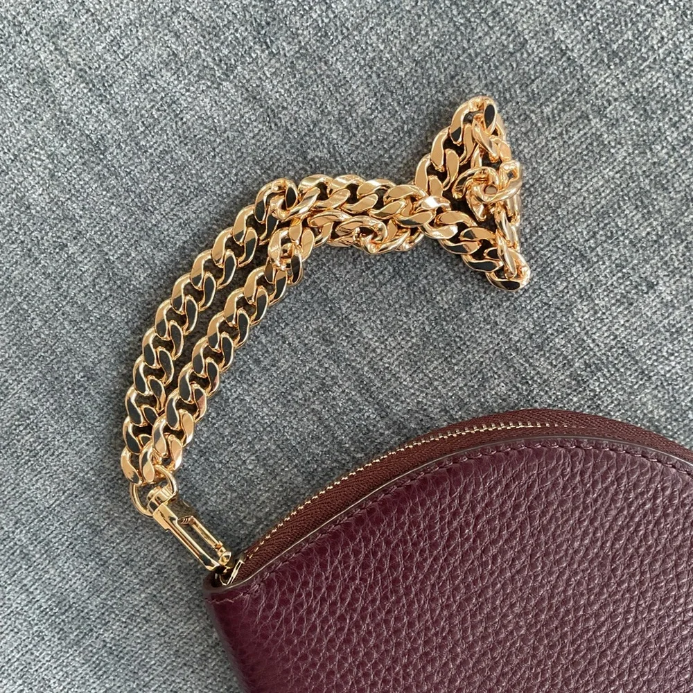 Kate Spade Jackson 1/2 Moon burgundy wristlet clutch leather gold chain